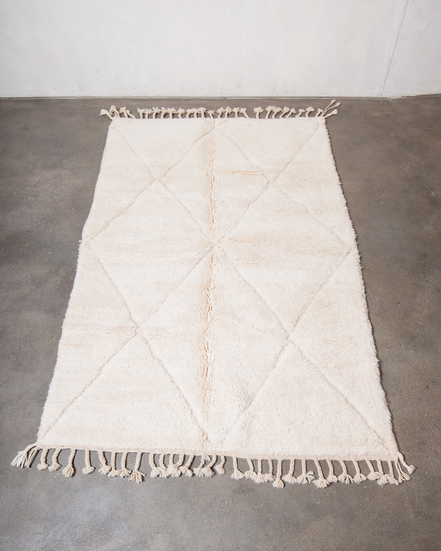 Modern, designer, handcrafted Berber rug from Morocco. Beniourain carpet with minimalist design, natural wool pile and a fluffy texture.